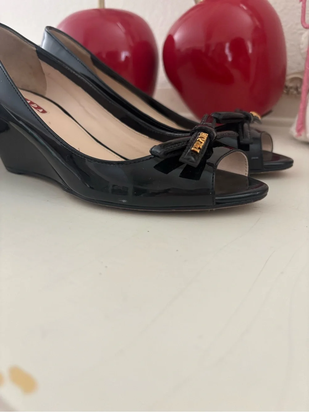 Prada Black Patent Leather Peep-Toe Wedges with Bow and Gold Accent